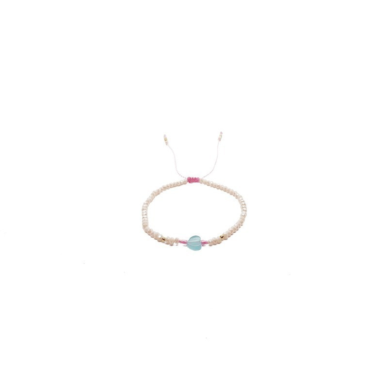 Pulsera de cristales beige con corazón al centro